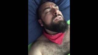 Big bearded and hairy bear wanking rubbing the bed sheet on his hard and wet cock. Beautiful Agony